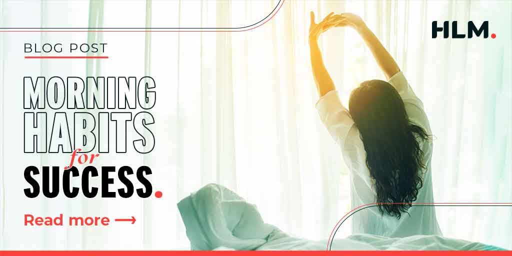 Image of a woman stretching gracefully in the morning sunlight on a bed, symbolizing the morning habits of successful business owners and the importance of starting the day with rejuvenation and self-care.